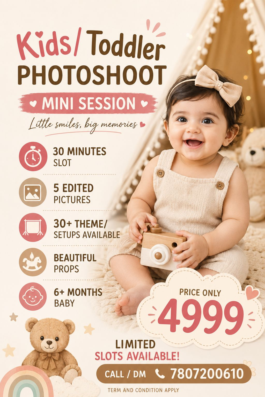 Happy toddler holding a toy camera for a photoshoot