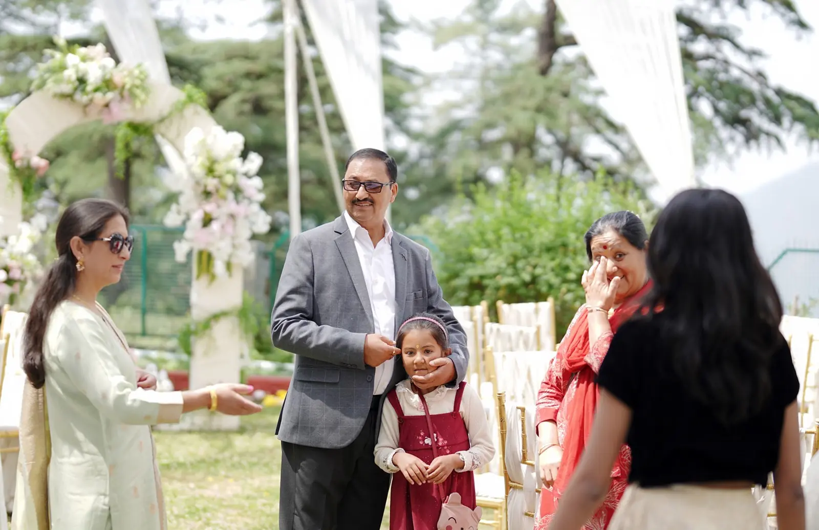 Engagement photoshoot featuring a couple in a romantic and stylish pose.