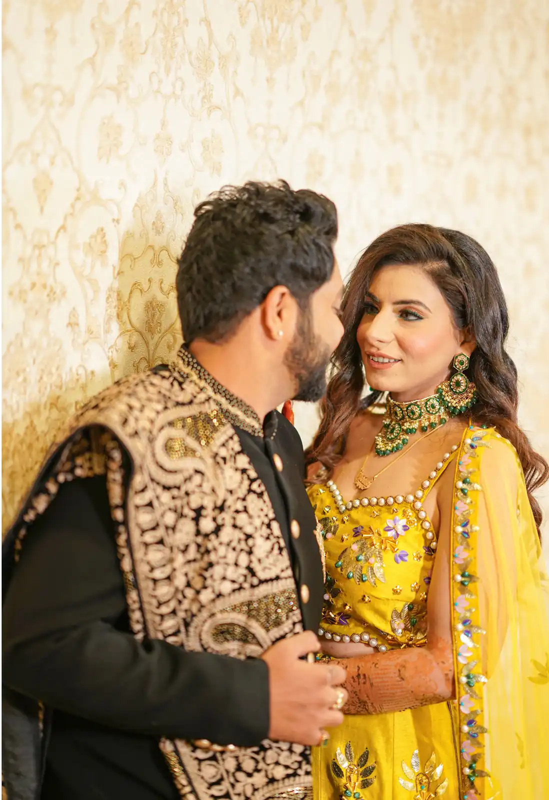 Outdoor engagement shoot featuring couple in a stylish modern pose