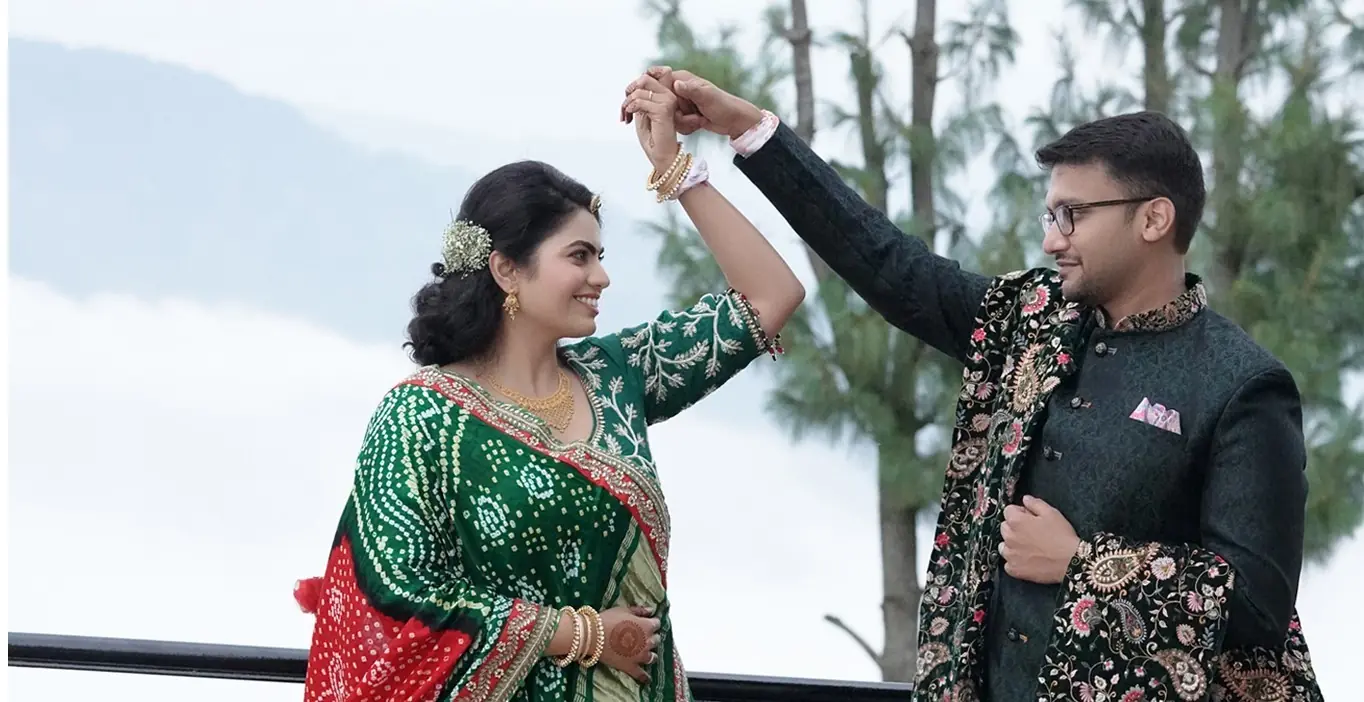 Engagement couple smiling and posing closely for a professional portrait