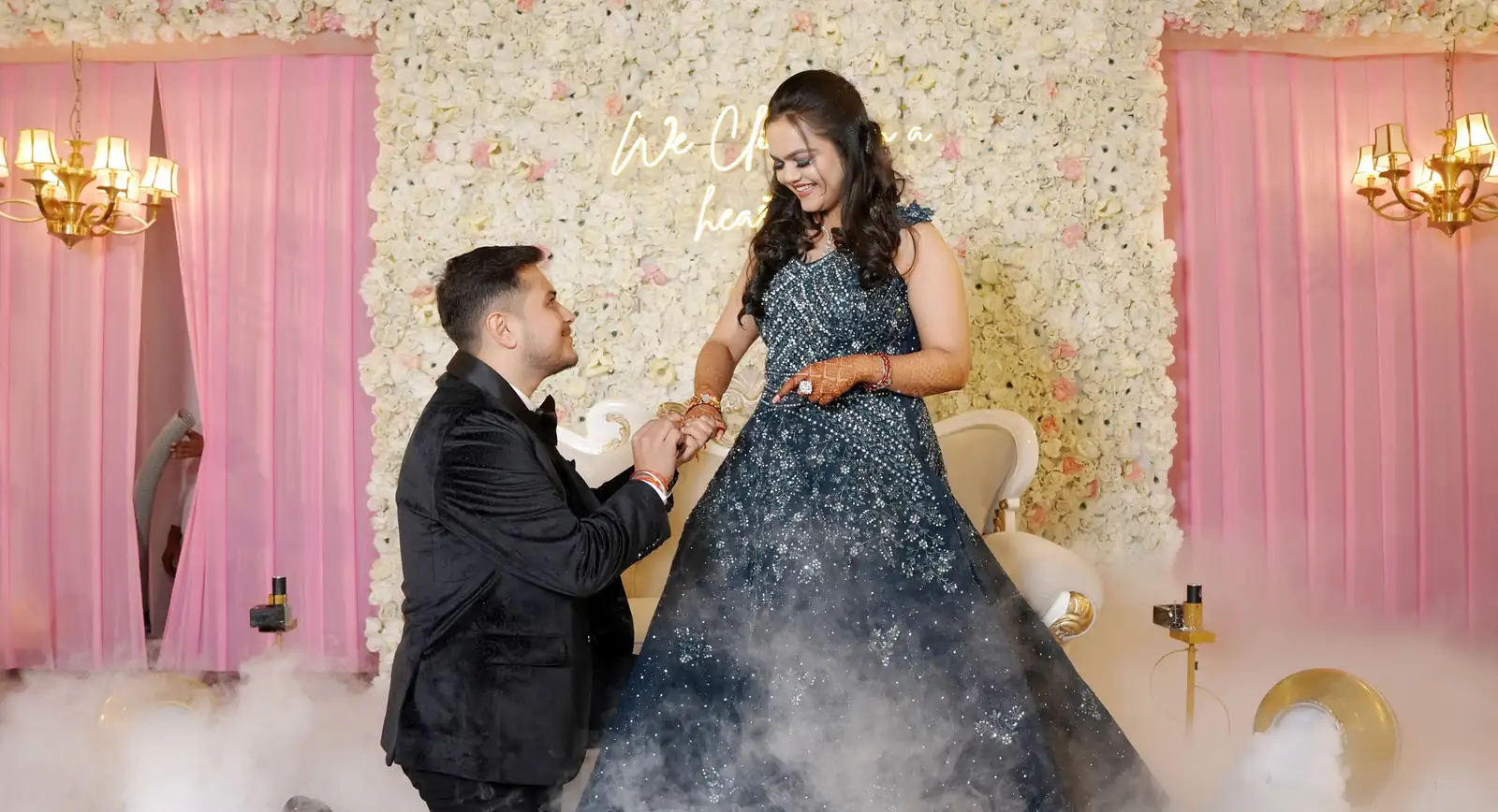 Engagement couple posing together in an outdoor photoshoot