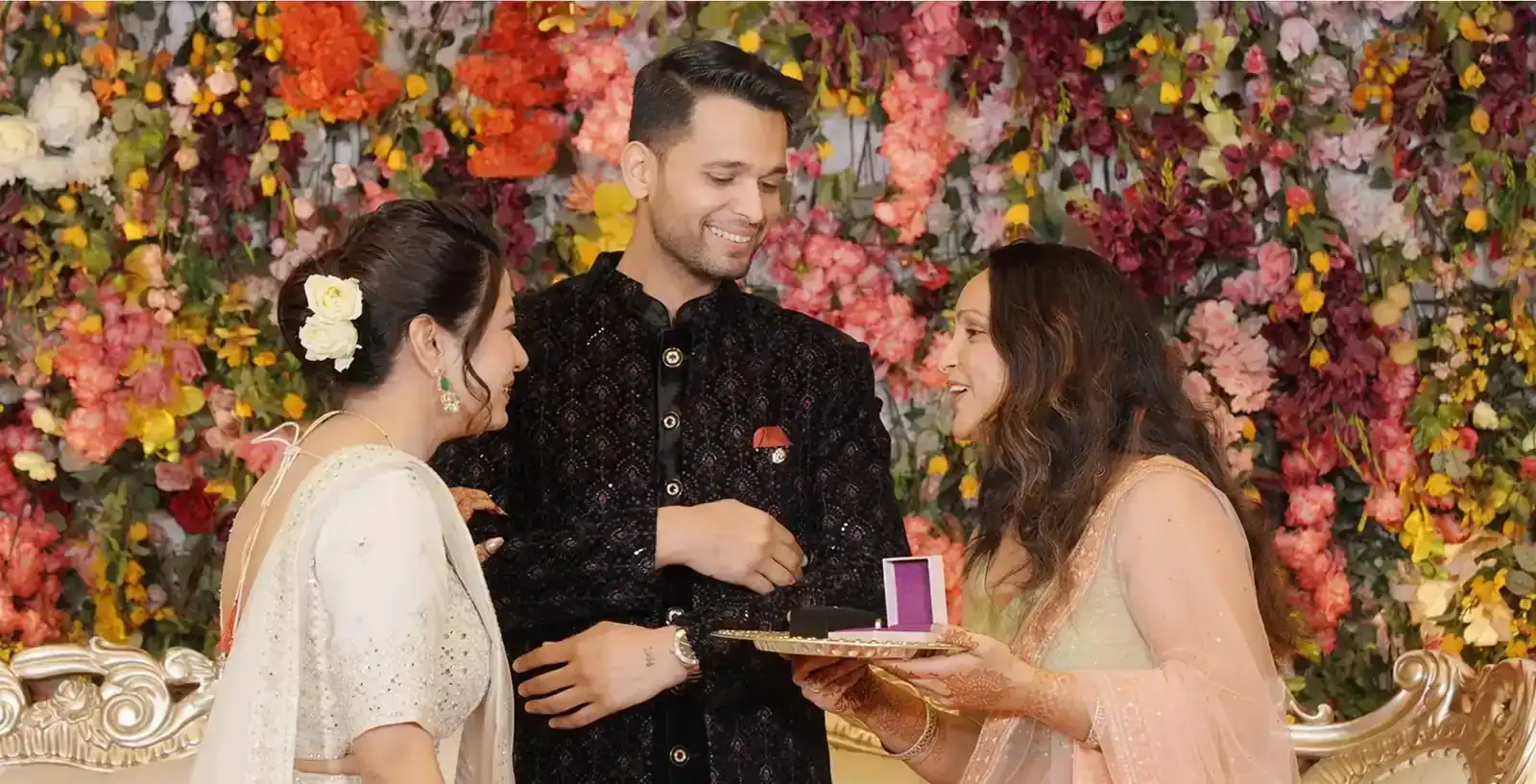 Candid photograph of couple embracing during engagement.