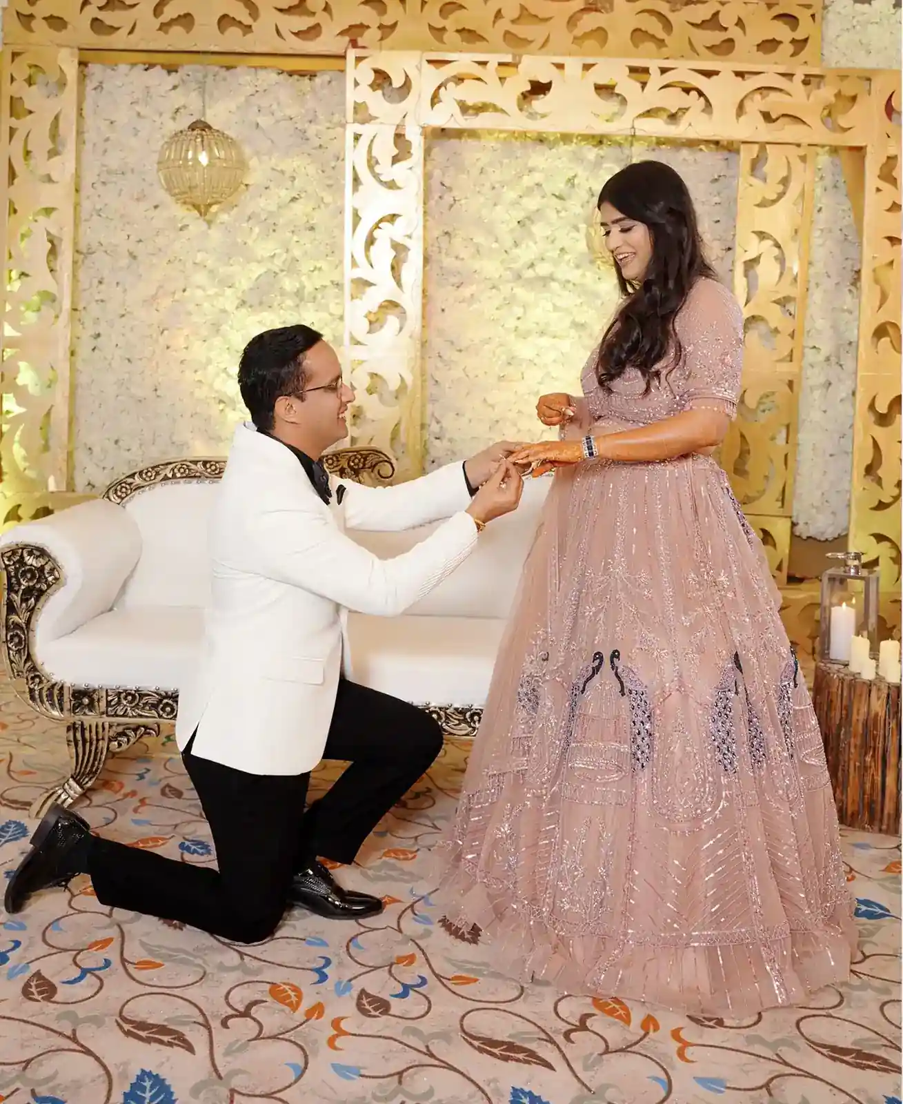 Engagement photoshoot couple posing in an elegant outdoor setting