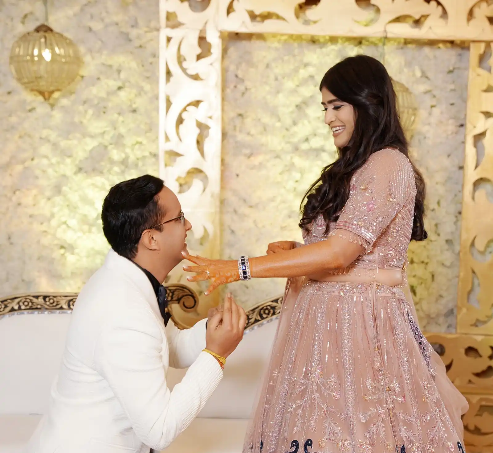 Romantic engagement shoot with couple holding hands