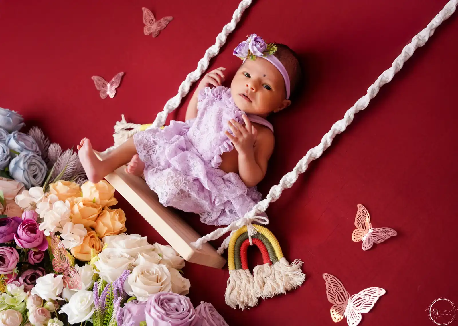 Sleeping newborn captured in a peaceful photoshoot pose