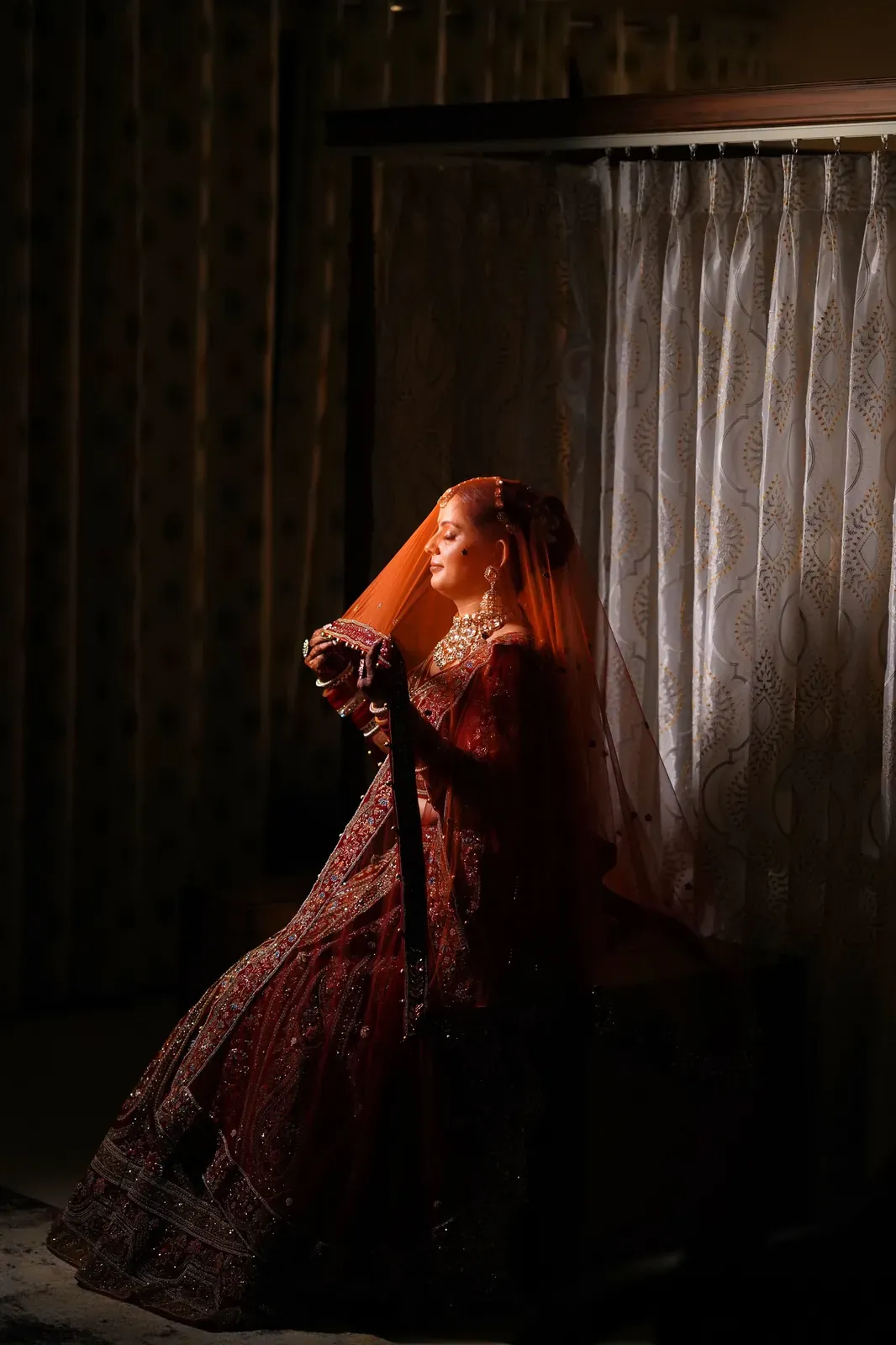 Bride and groom posing elegantly in their wedding attire