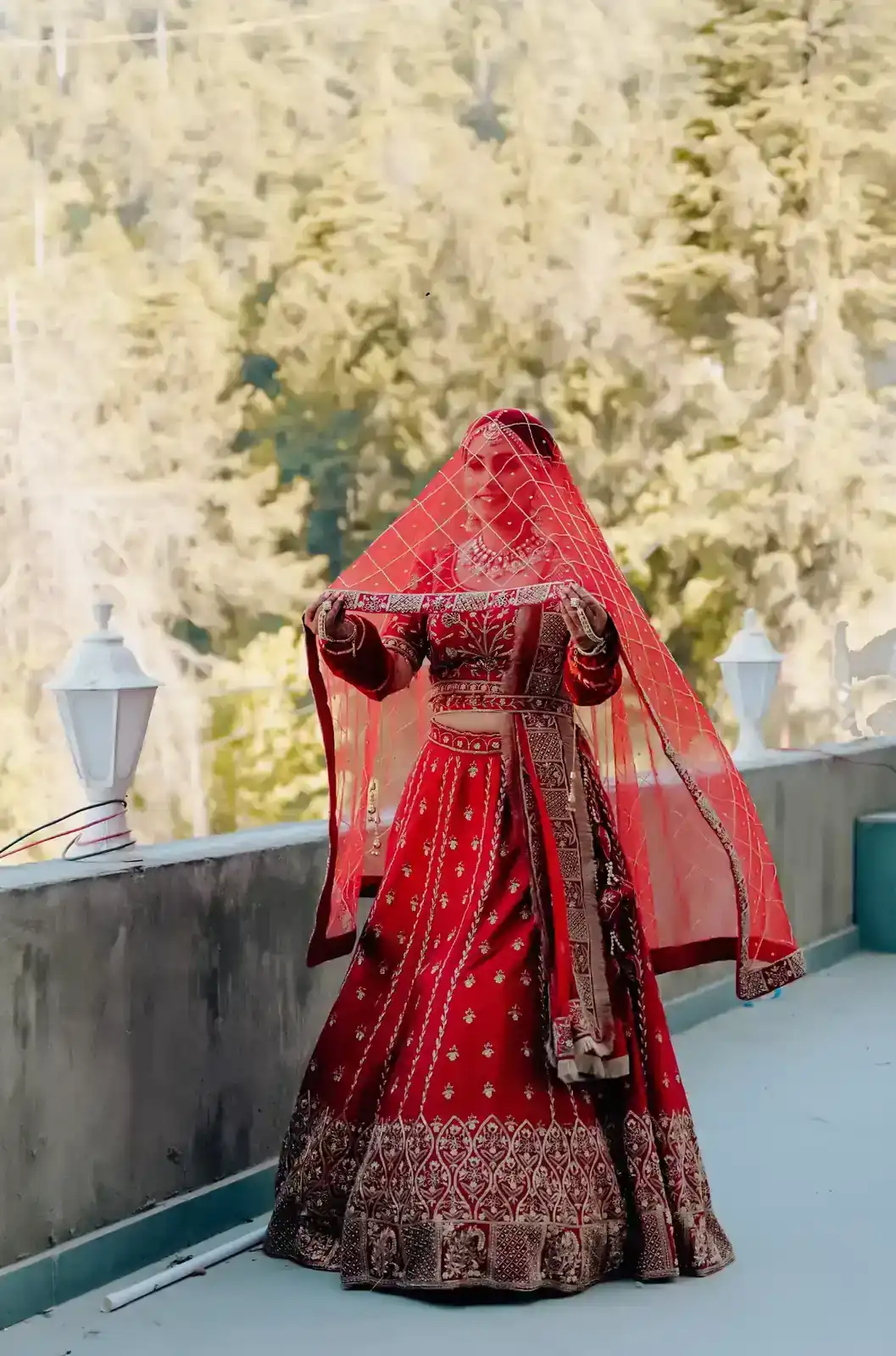 Bride and groom posing outdoors.