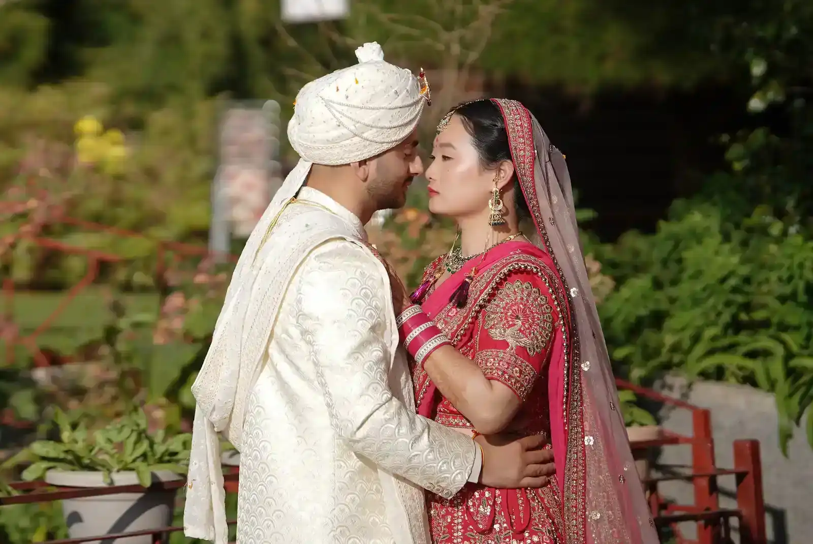 Bride and groom in traditional Indian wedding attire.